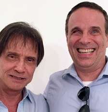 Dugu Braga ao lado do pai, Roberto Carlos: uma vida de desafios, sem perder a alegria Foto: Reprodução