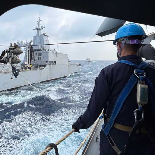 How does a frigate refuel while at sea?
