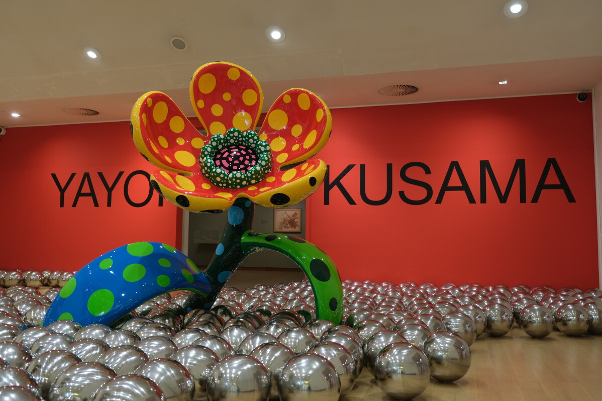 Flowers and reflective balls are seen at a major retrospective of works by recently deceased Japanese artist Yayoi Kusama at the Stedelijk Museum in Amsterdam, Wednesday, Sept. 9, 2026. (AP Photo/Mike Corder)